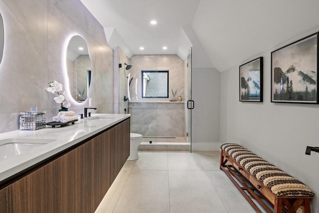bathroom with toilet, tile patterned floors, a shower stall, and double vanity