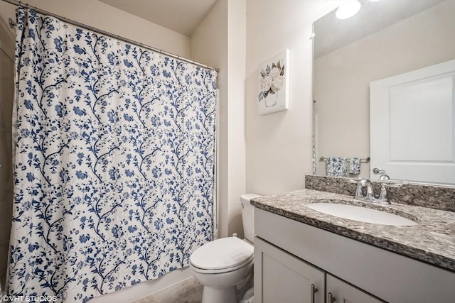 bathroom featuring vanity, toilet, and a shower with curtain