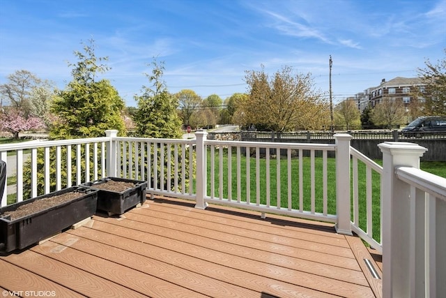 deck with fence and a yard