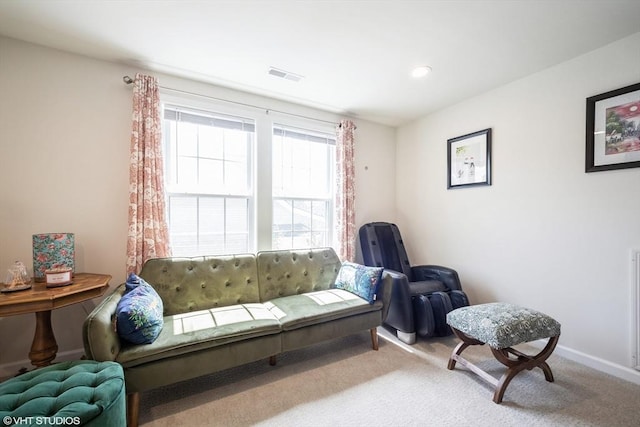 living area featuring visible vents, recessed lighting, baseboards, and carpet floors