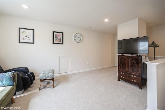 living area with recessed lighting, baseboards, and light carpet