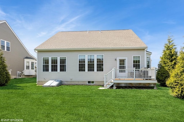 back of house with a yard and a deck