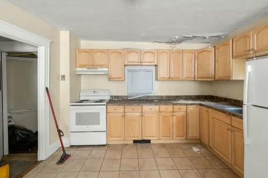 145-169 N Washington St, Boston, MA 02114 - kitchen with white appliances, light brown cabinets, exhaust hood, dark countertops, and light tile patterned floors