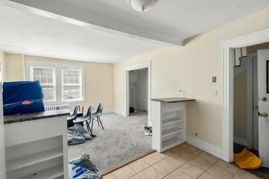 145-169 N Washington St, Boston, MA 02114 - home office featuring light tile patterned flooring, light colored carpet, and baseboards