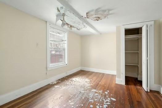 145-169 N Washington St, Boston, MA 02114 - unfurnished bedroom featuring wood finished floors, baseboards, and a closet