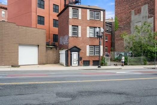 145-169 N Washington St, Boston, MA 02114 - view of building exterior featuring an attached garage