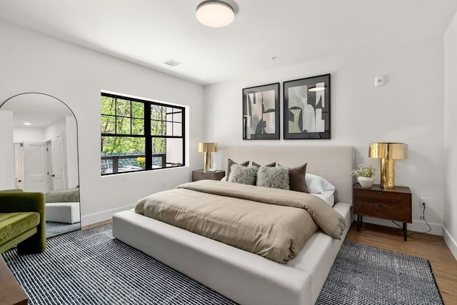20 Audubon Way Unit 208, Canton, MA 02021 - bedroom featuring baseboards and wood finished floors