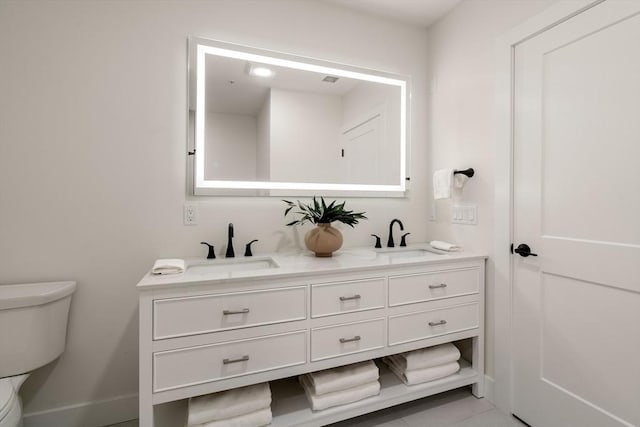20 Audubon Way Unit 208, Canton, MA 02021 - bathroom with toilet, double vanity, and baseboards