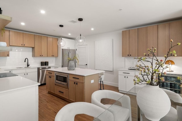 20 Audubon Way Unit 208, Canton, MA 02021 - kitchen featuring stainless steel appliances, a sink, dark wood-type flooring, backsplash, and recessed lighting