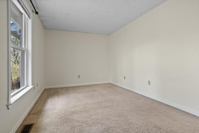 view of carpeted spare room