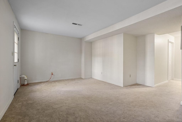 unfurnished room with light carpet