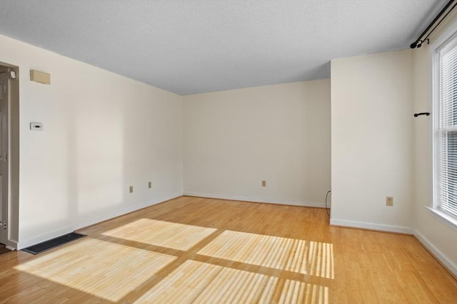 empty room featuring wood-type flooring