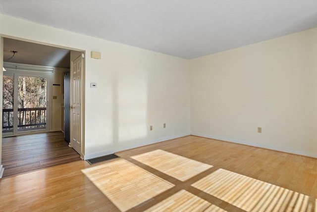 unfurnished room featuring wood-type flooring