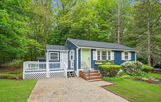 9 Josephine, Canton, MA 02021 - view of front of house with a front yard, a deck, and roof with shingles