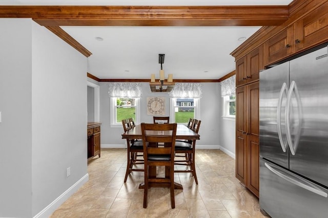 dining area featuring ornamental molding and baseboards