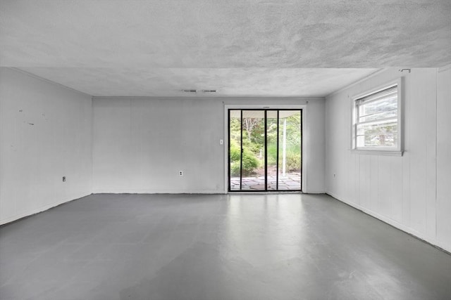 23 Eastview Ave, Billerica, MA 01821 - empty room featuring finished concrete floors and a textured ceiling
