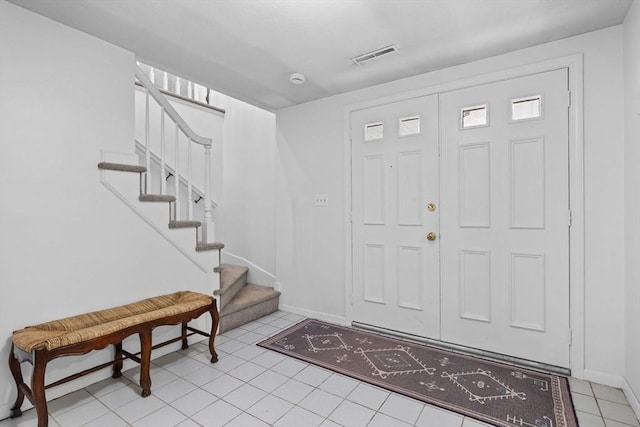23 Eastview Ave, Billerica, MA 01821 - foyer featuring stairway and light tile patterned floors