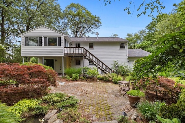 23 Eastview Ave, Billerica, MA 01821 - back of house with stairway, a deck, and a patio area