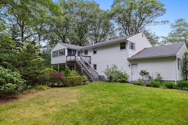 23 Eastview Ave, Billerica, MA 01821 - back of property with stairs, a yard, a deck, a shingled roof, and a sunroom