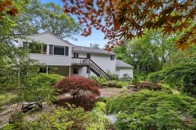 23 Eastview Ave, Billerica, MA 01821 - rear view of house featuring stairs and a wooden deck