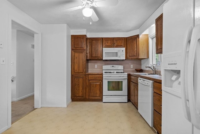 23 Eastview Ave, Billerica, MA 01821 - kitchen with white appliances, light flooring, ceiling fan, and brown cabinets