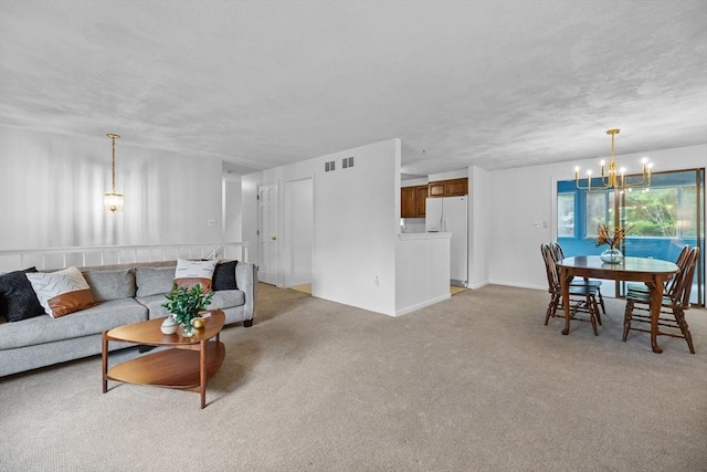 23 Eastview Ave, Billerica, MA 01821 - living area featuring a chandelier and light carpet