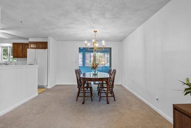23 Eastview Ave, Billerica, MA 01821 - dining space featuring a chandelier and light carpet