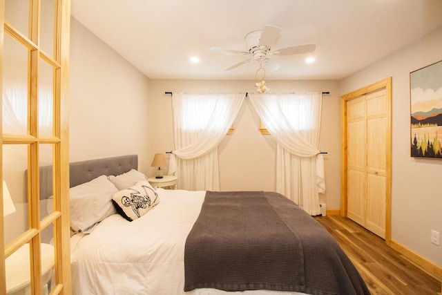 bedroom with recessed lighting, ceiling fan, baseboards, and wood finished floors