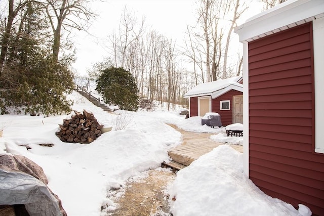 yard covered in snow with an outdoor structure