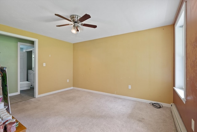 carpeted empty room with a baseboard radiator and ceiling fan