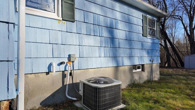 view of side of home featuring central AC