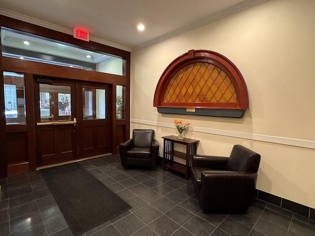 tiled entrance foyer featuring ornamental molding