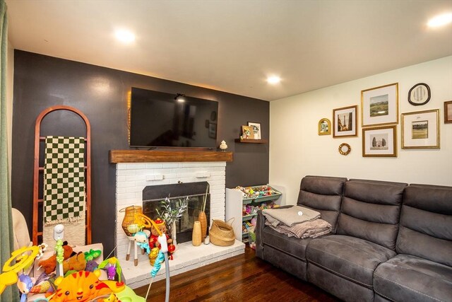 36 Pratt St, Brockton, MA 02302 - living room with wood finished floors and a brick fireplace