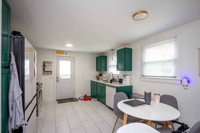 36 Pratt St, Brockton, MA 02302 - kitchen featuring green cabinets, dishwashing machine, light countertops, and stainless steel range oven