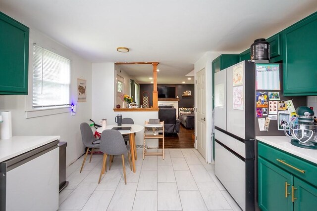 36 Pratt St, Brockton, MA 02302 - kitchen with freestanding refrigerator, light countertops, green cabinets, white dishwasher, and open floor plan