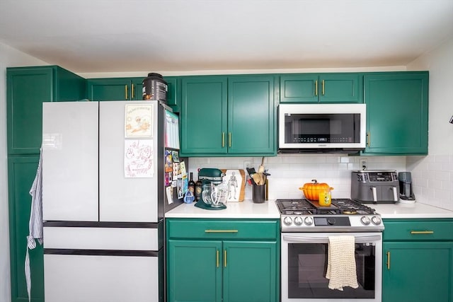 36 Pratt St, Brockton, MA 02302 - kitchen featuring stainless steel appliances, light countertops, and decorative backsplash