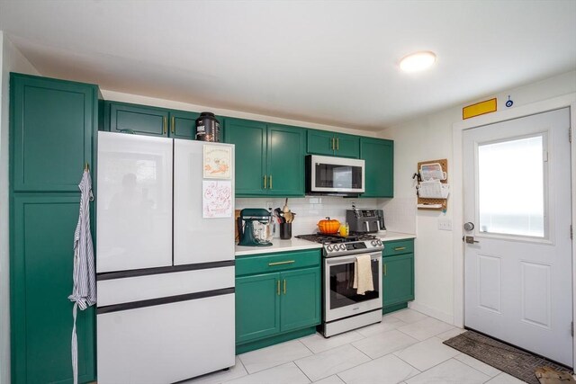 36 Pratt St, Brockton, MA 02302 - kitchen featuring stainless steel gas range, freestanding refrigerator, green cabinetry, decorative backsplash, and light countertops