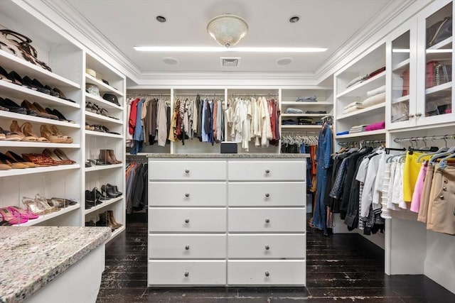 walk in closet with dark wood-type flooring and visible vents