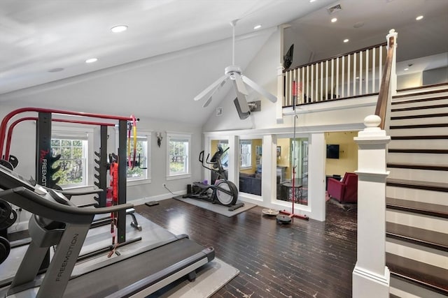 interior space with a healthy amount of sunlight, high vaulted ceiling, visible vents, and wood finished floors