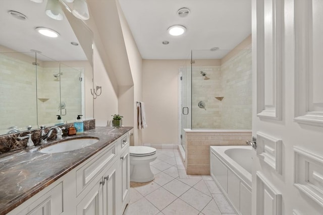 bathroom with a garden tub, toilet, a shower stall, vanity, and tile patterned floors