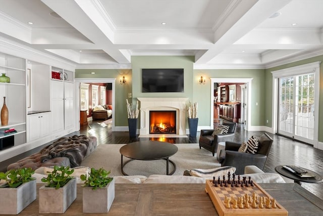 living area featuring plenty of natural light, a fireplace, and coffered ceiling