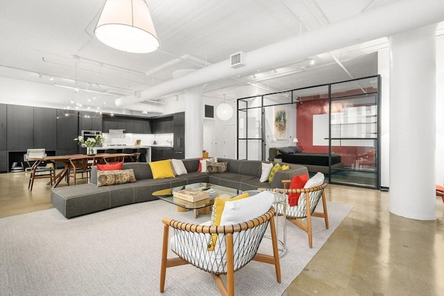 437 D St Unit 4F, Boston, MA 02210 - living area featuring finished concrete floors