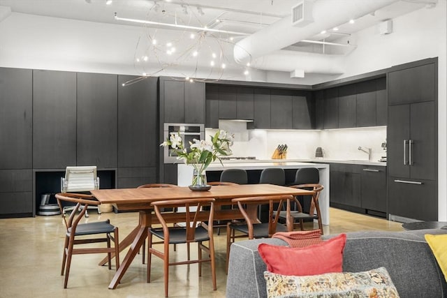 437 D St Unit 4F, Boston, MA 02210 - dining area featuring concrete floors and a towering ceiling