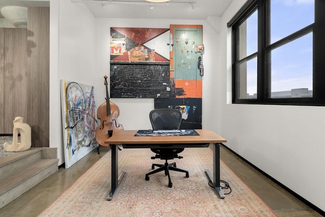 437 D St Unit 4F, Boston, MA 02210 - office area featuring finished concrete floors and baseboards