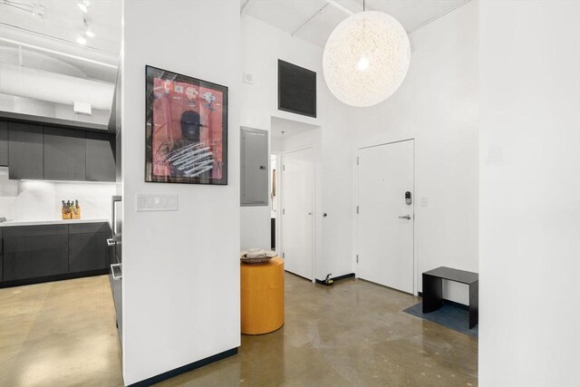 437 D St Unit 4F, Boston, MA 02210 - hall with concrete flooring, a high ceiling, and electric panel
