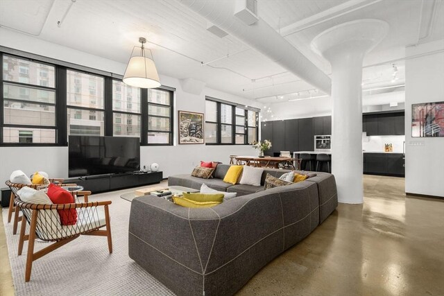437 D St Unit 4F, Boston, MA 02210 - living room with concrete flooring