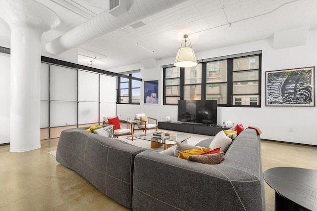 437 D St Unit 4F, Boston, MA 02210 - living room featuring finished concrete flooring and baseboards