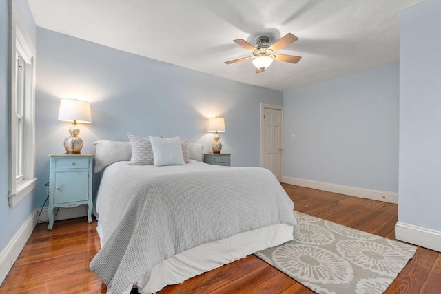 bedroom featuring hardwood / wood-style floors and ceiling fan