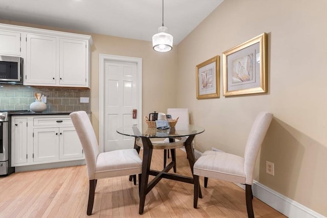 dining room with light hardwood / wood-style floors