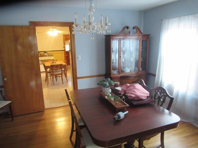 dining room featuring an inviting chandelier and wood finished floors